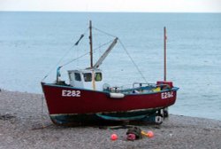 Fishing boat on beach in Beer Wallpaper