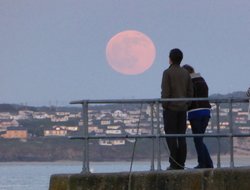The Moon rising over West Pier, St. Ives, Cornwall. Wallpaper