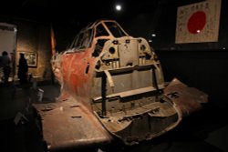 Remains of a Mitsubishi A6M Zero fighter . Wallpaper