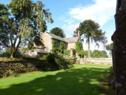 A Lovely house beside the church in Talkin Village Wallpaper