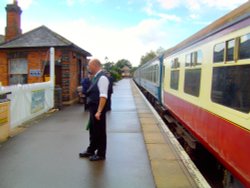 North Weald Station and stationmaster vintage Br Carrages Wallpaper