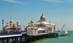 Eastbourne Pier with sail boat Wallpaper