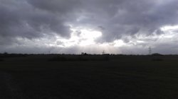 Heavy clouds over Suffolk farm land Wallpaper