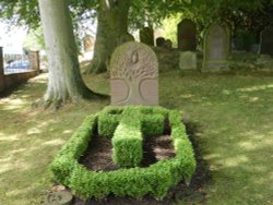 A beautiful headstone in the churchyard at Crosby- on -Eden, Cumbria Wallpaper