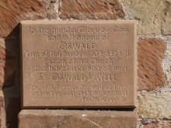 ST OSWALD,CHURCH PLAQUE ON END OF CHURCH.Kirkoswald,Cumbria. Wallpaper