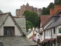 Dunster view with castle sitting above the village Wallpaper