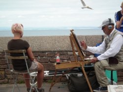 Caricature artist on Minehead seafront Wallpaper