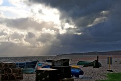 Budleigh Salterton with dark clouds Wallpaper