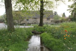 The Swine Brook in the centre of Swinbrook Wallpaper