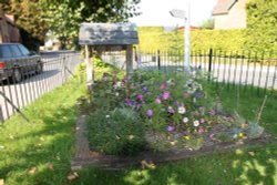 A pretty decoration around the village well in Broad Hinton Wallpaper