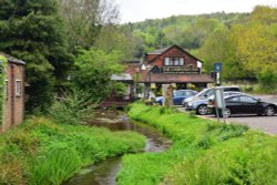 The Compasses Inn by the TillingBourne River in Gomshall. Wallpaper