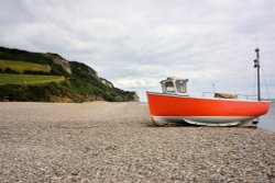 A Freshly Painted Fishing Boat on Branscombe Beach Wallpaper