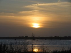 Beautiful bronzy sunset over Christchurch harbour from Mudeford Quay Wallpaper