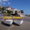 Spa Pavilion and boats used as flower planters at Felixstowe, Suffolk.