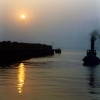 A Steam Tug Approaching Whitstable Harbour at Sunset