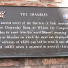 A sign outlining the history of The Shambles, York