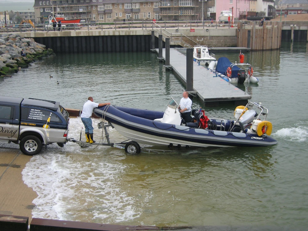 A boat being launched from the new slip
