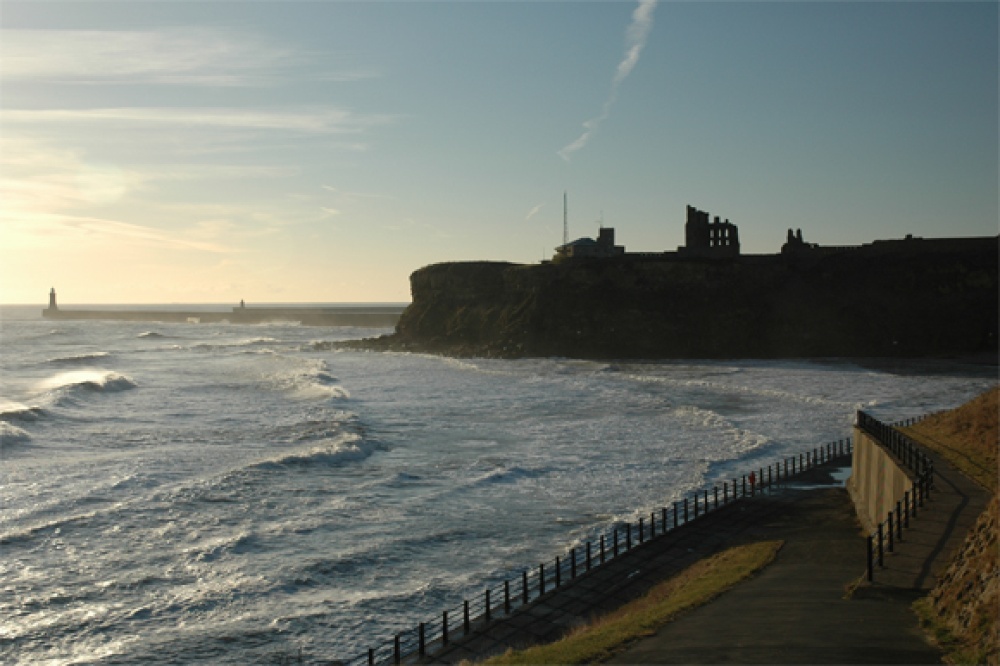 Tynemouth Castle and Priory, and North Pier with South Pier behind.