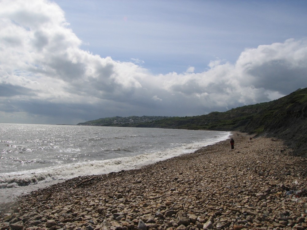 Clouds seeming to mimic the curves of the bay at Charmouth, Dorset