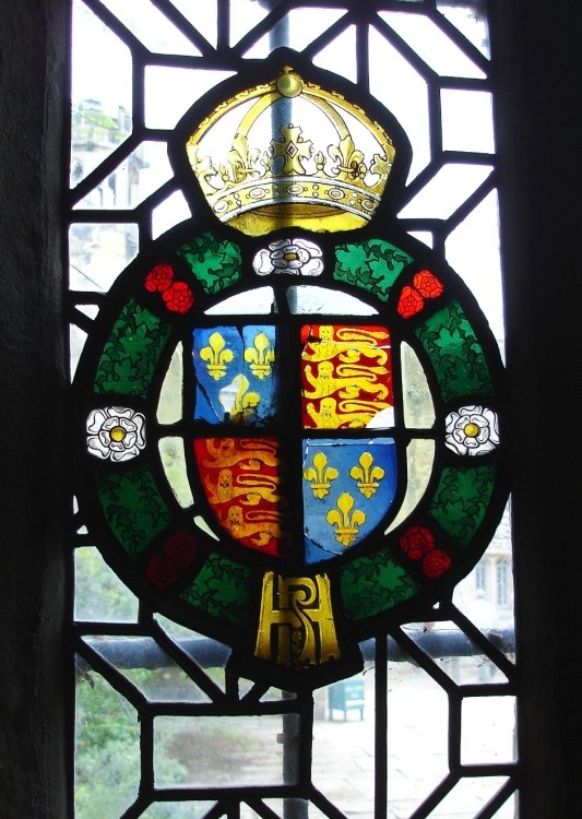 Ancient stained glass showing the royal arms at Haddon Hall, Derbyshire