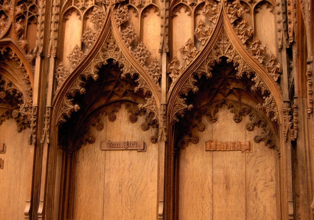 Norwich Cathedral, upper choir stalls with crocketed ogee arch canopies. Norwich, Norfolk.