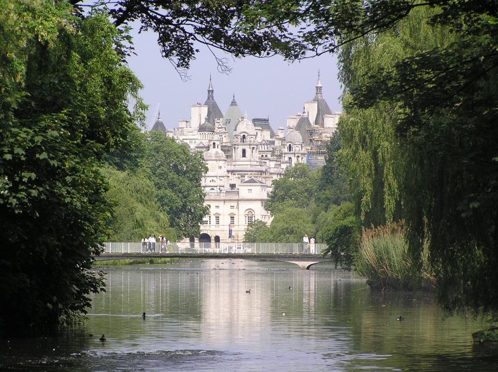 A glimpse of Horseguards Parade across the lake in St James Park, central London.