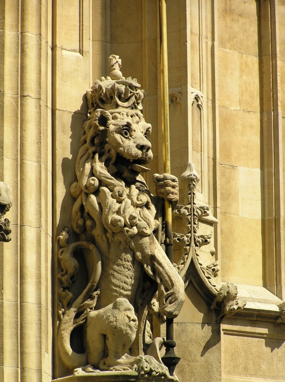 A royal lion guards the entrance to St Stephen's tower, part of the Houses of Parliament, London