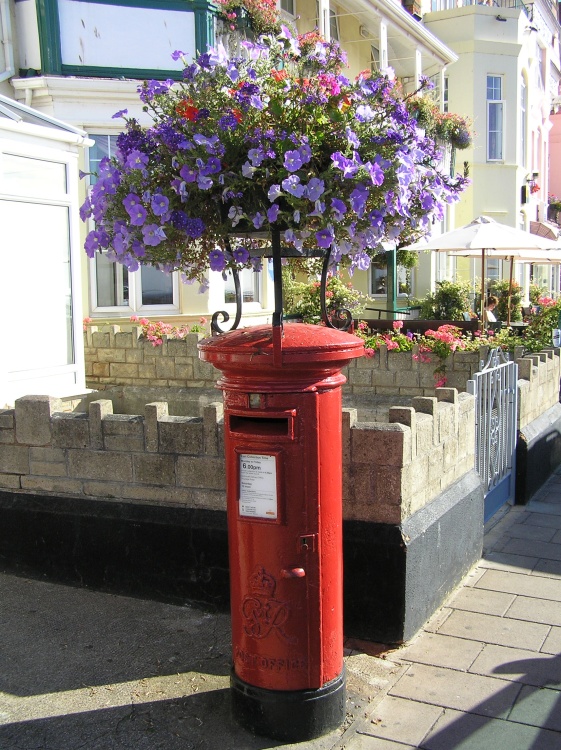 Even the sea front post box gets the floral treatment at Sidmouth, South East Devon.