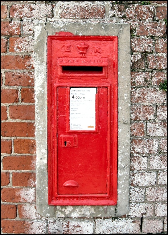 Wall mounted, and much repainted Edward VII Postbox, Upper Row, Dunham-on-Trent, Nottinghamshire