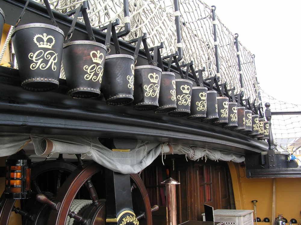 A row of buckets on the deck of HMS Victory, Portsmouth, Hampshire