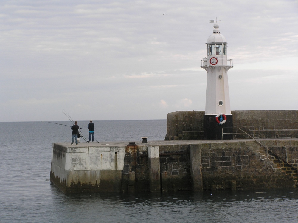 Lighthouse marking the outer edge of Mevagissey harbour, Cornwall