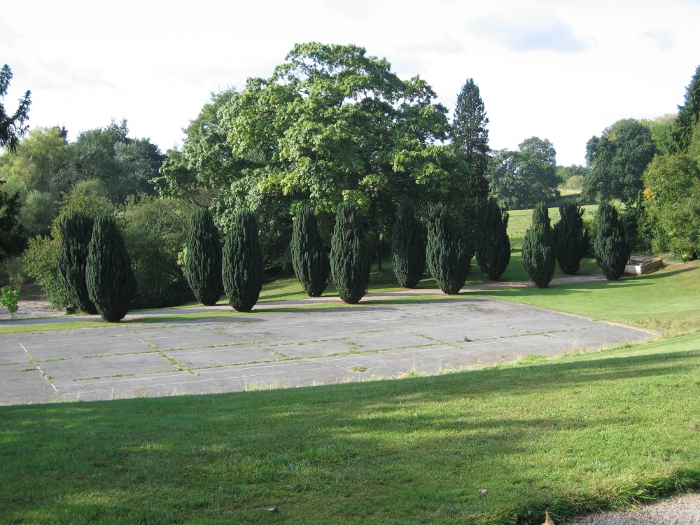 Old tennis courts and tree lined footpath at Tyntesfield, Wraxall, Somerset