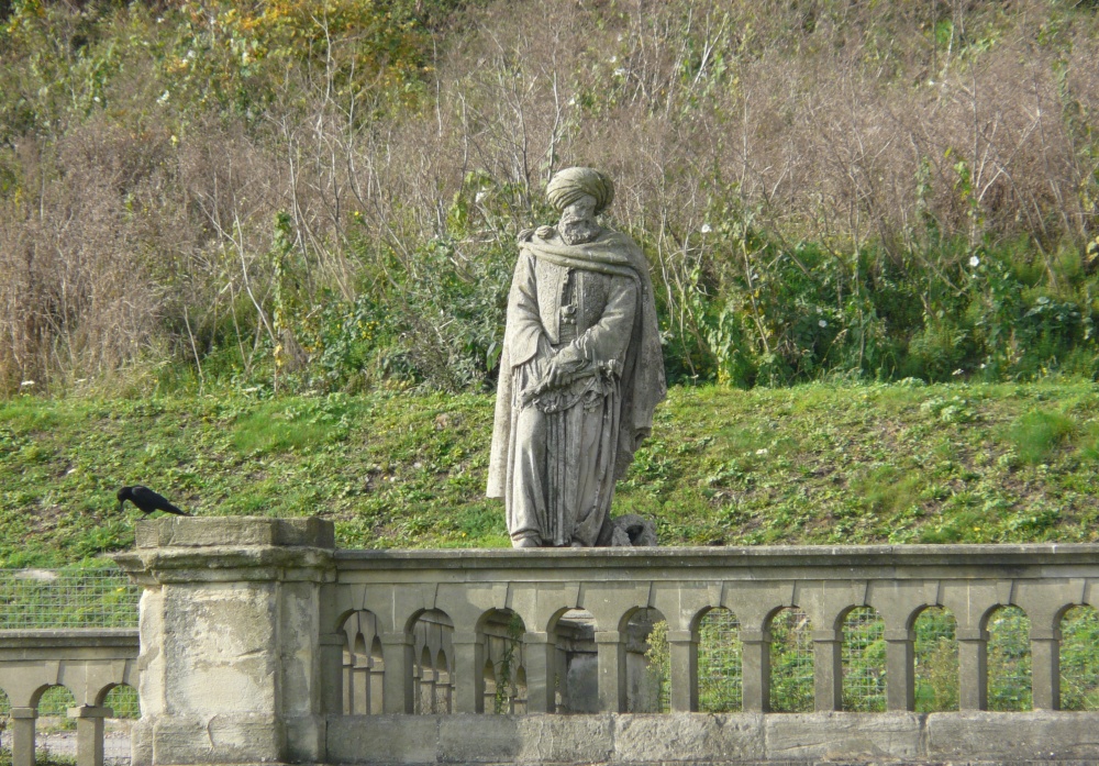 A Forlorn Statue With Only a Crow for Company