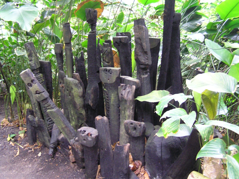 Carved faces in the tropical biome at Eden