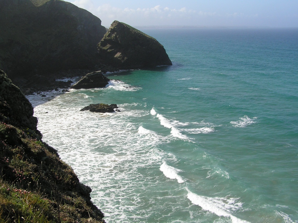 Waves on a perfect blue sea at Bedruthan Steps in Cornwall