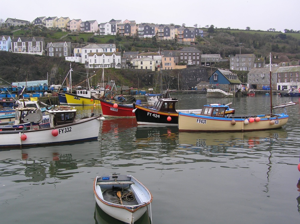 Boats in Mevagissey harbour at high tide