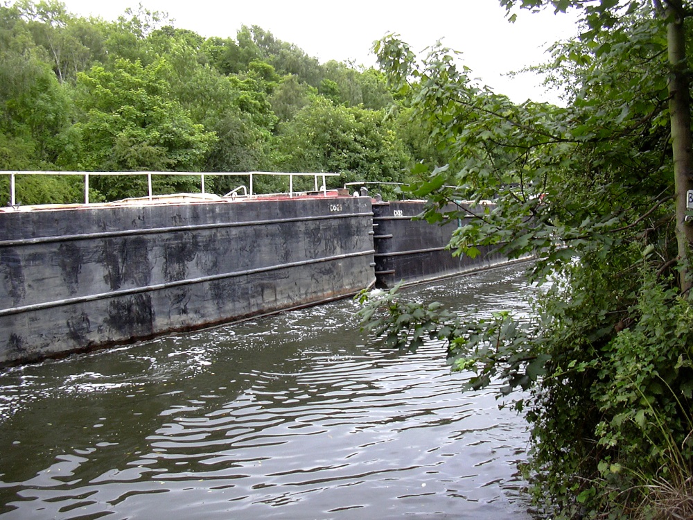 Workboats haul 'trains' of barges on the River Don