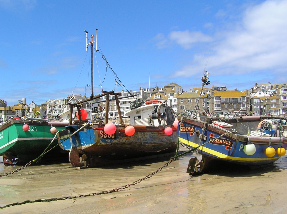 Boats beached in St Ives harbour at low tide