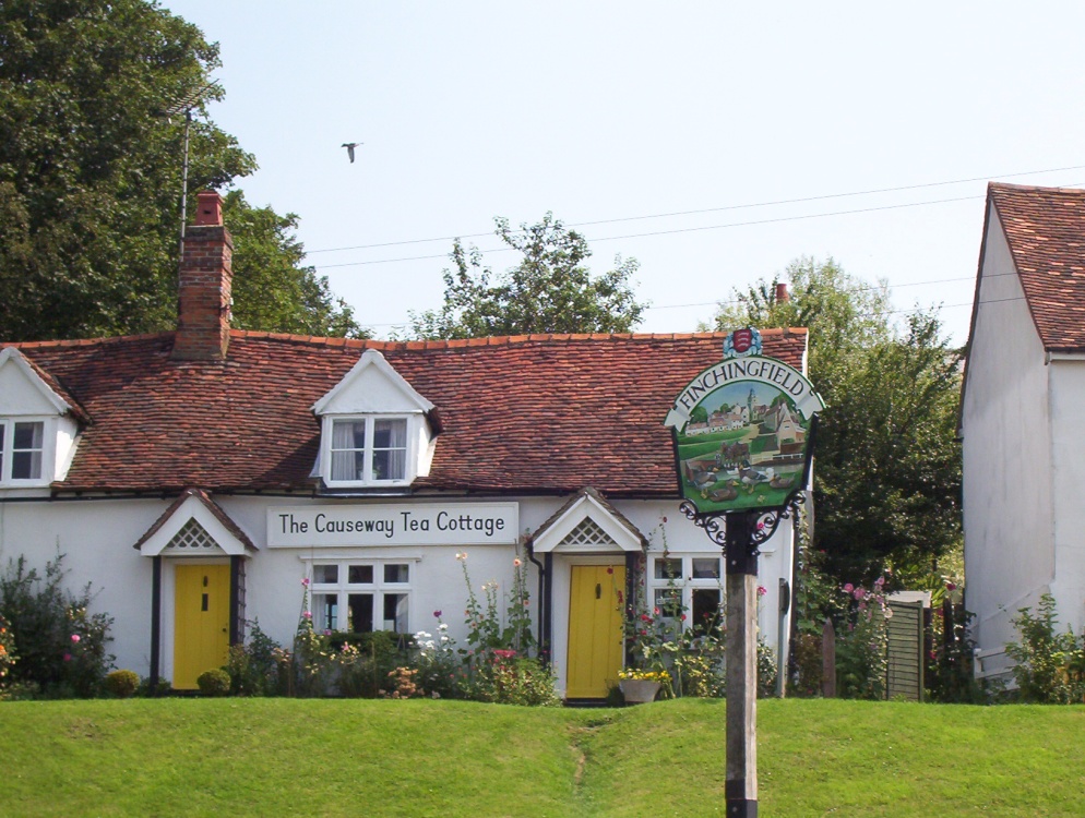 The tea rooms cottage and village sign