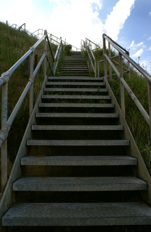 Steps from the beach to the top of the cliffs.