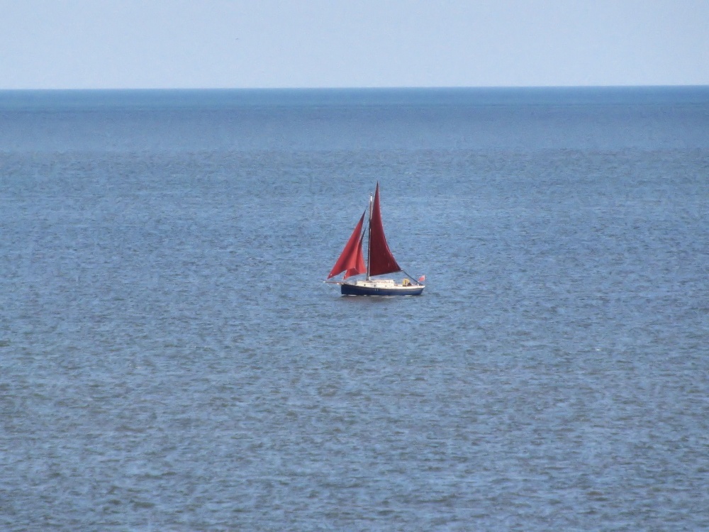Lonely little sailing boat off Corton.