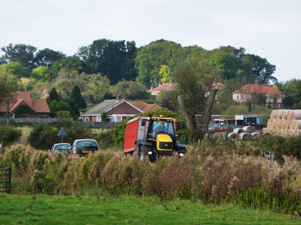 Tractor and Trailer winding it's way through the village