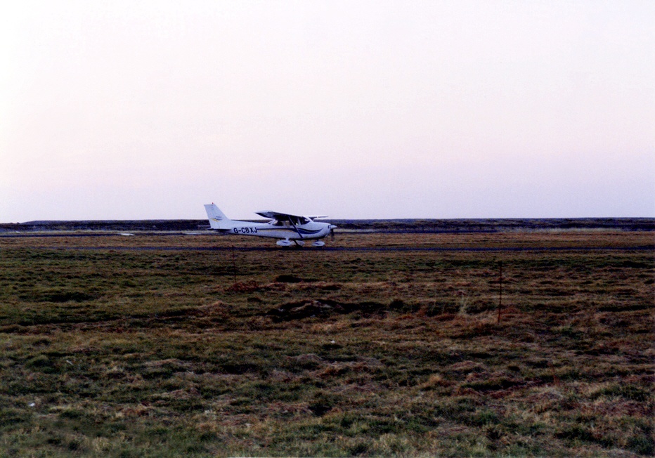 Plane landing at the airstrip.