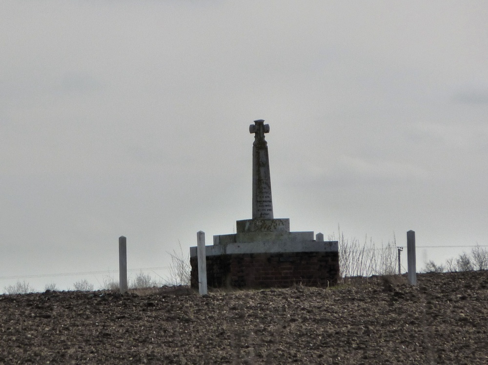 Monument to Saint Edmund in the middle of a ploughed field