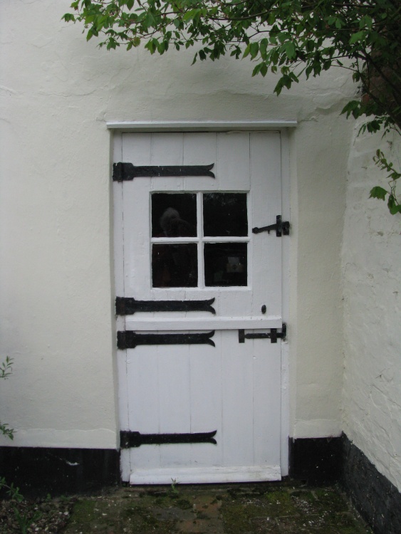 A quaint door on a house near the Church