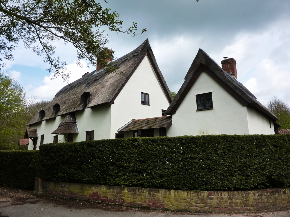 Thatched Houses on a busy road side
