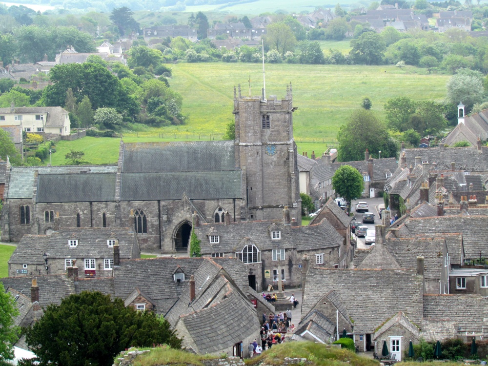 The church, and village of Corfe Castle, in Dorset