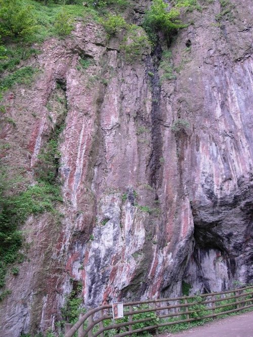 Castleton: - Cliff face above the entrance to Peak Cavern