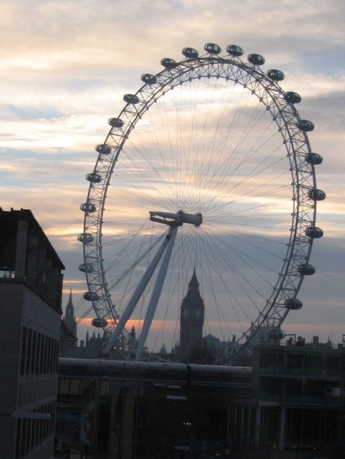 London Eye with Big Ben in the background. London.