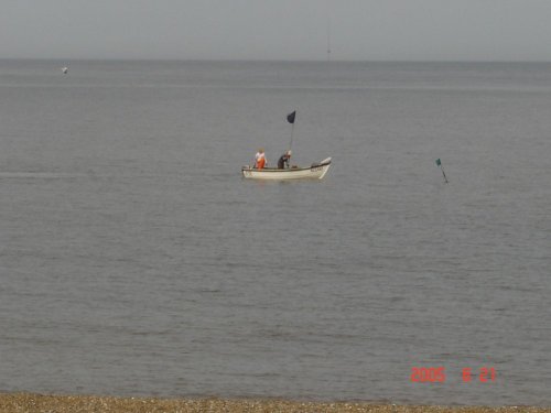 fishmen in sea at Caister, Norfolk.